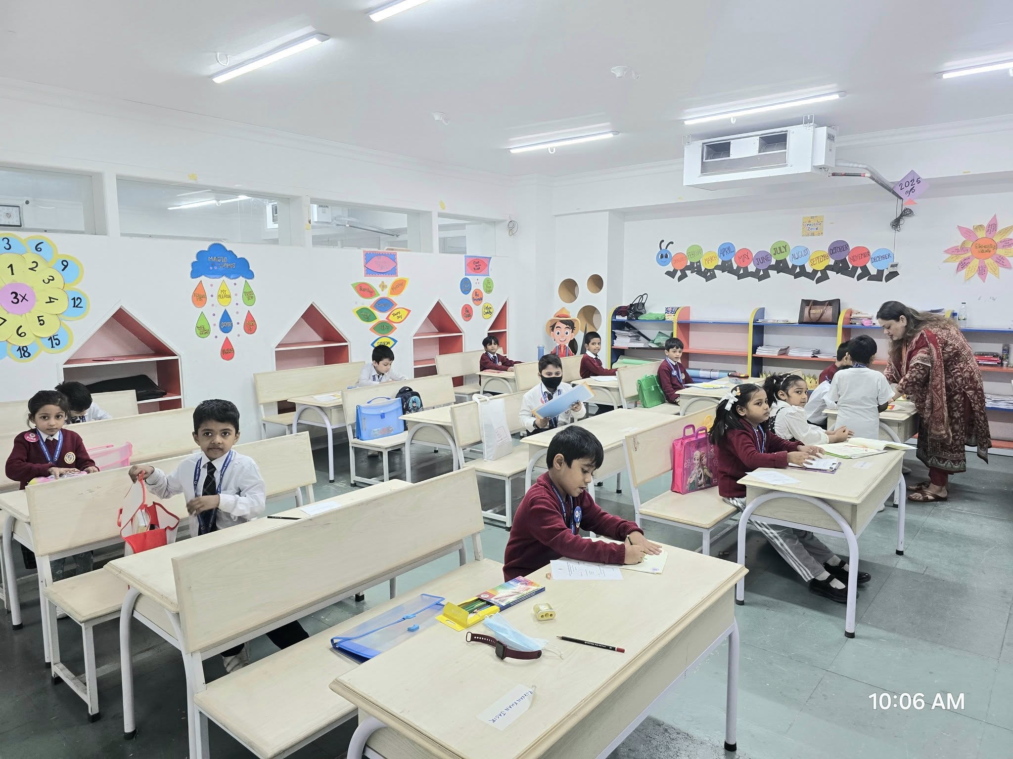 Primary school students with vibrant educational wall displays